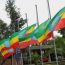 Ethiopian Flag raised in half -mass